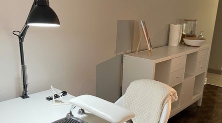 NailedbyNehita nail salon workspace in Toronto, Ontario, CA, showcasing a stylish manicure desk and modern lighting.