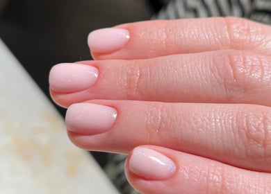 Elegant soft pink manicure at Nailedby Nehita, Toronto, Ontario, CA, showcasing smooth nail finish.