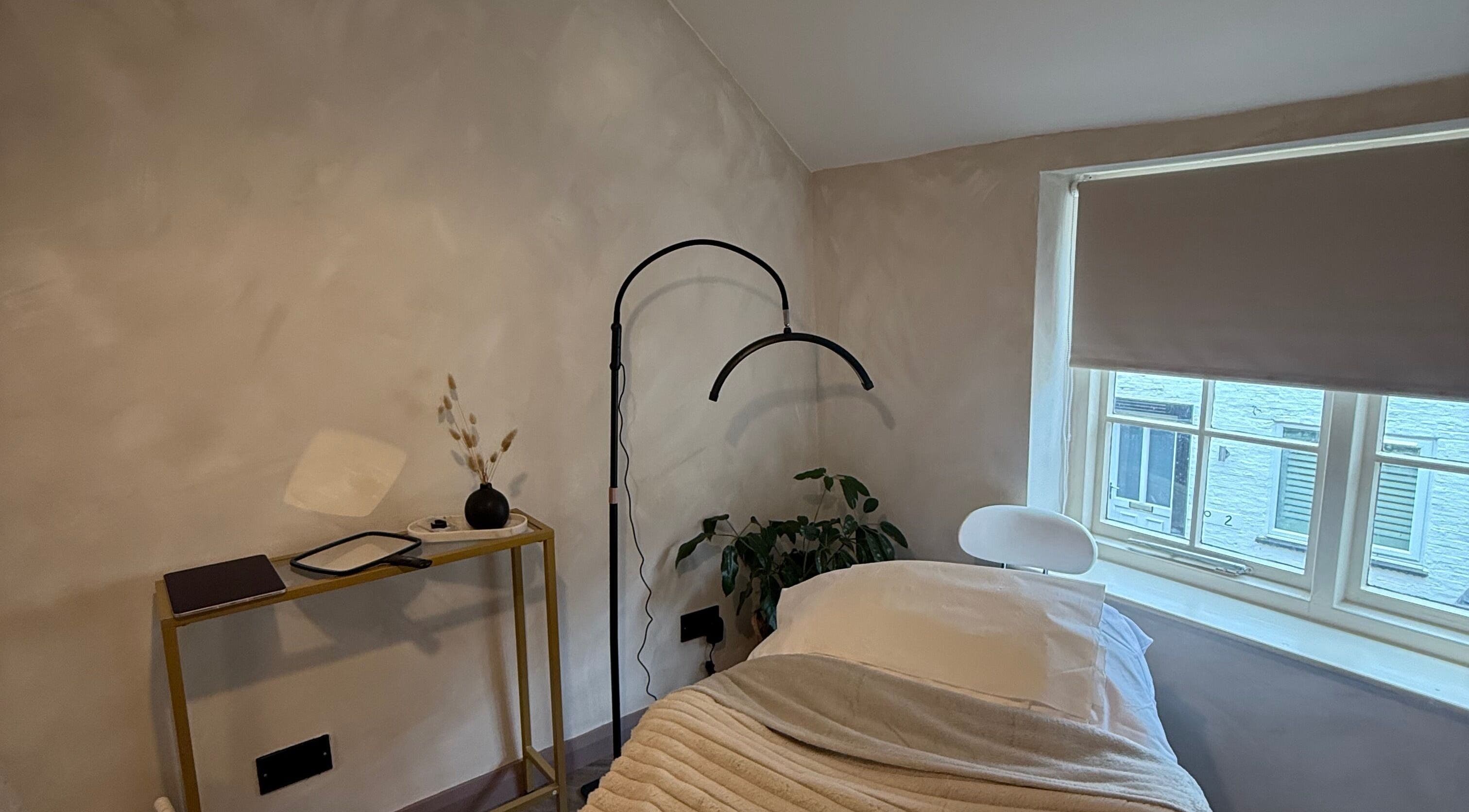Relaxing treatment room at Bare and Glow Skin, Ripon, England, GB, featuring cozy bed and natural decor.