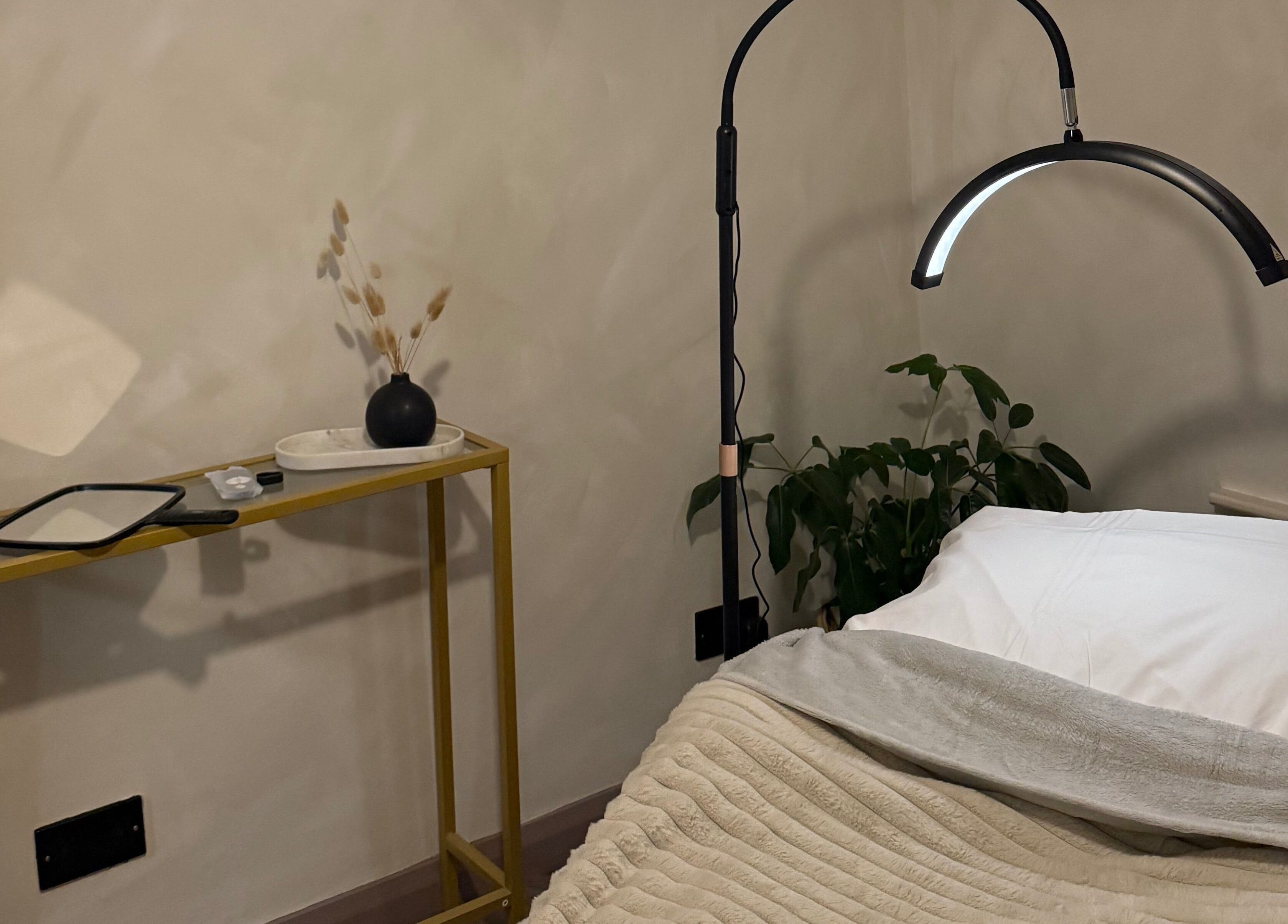 Cozy treatment room at Bare and Glow Skin, Ripon, England, GB, featuring a serene setup with lighting and decor.