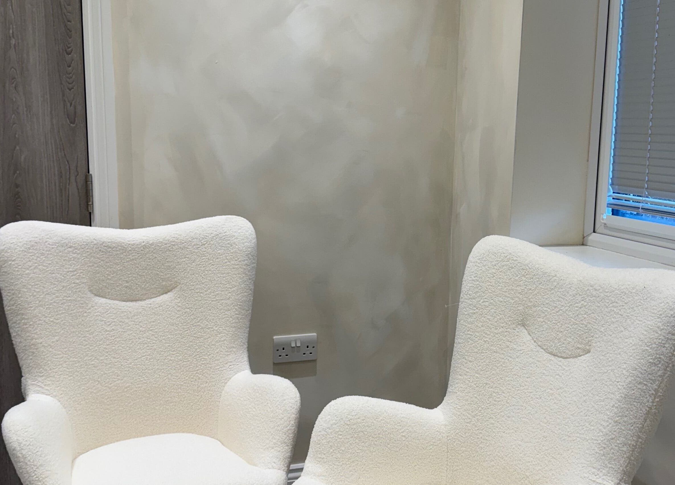 Comfortable lounge chairs at Bare and Glow Skin, Ripon, England, GB, offering a serene waiting area.