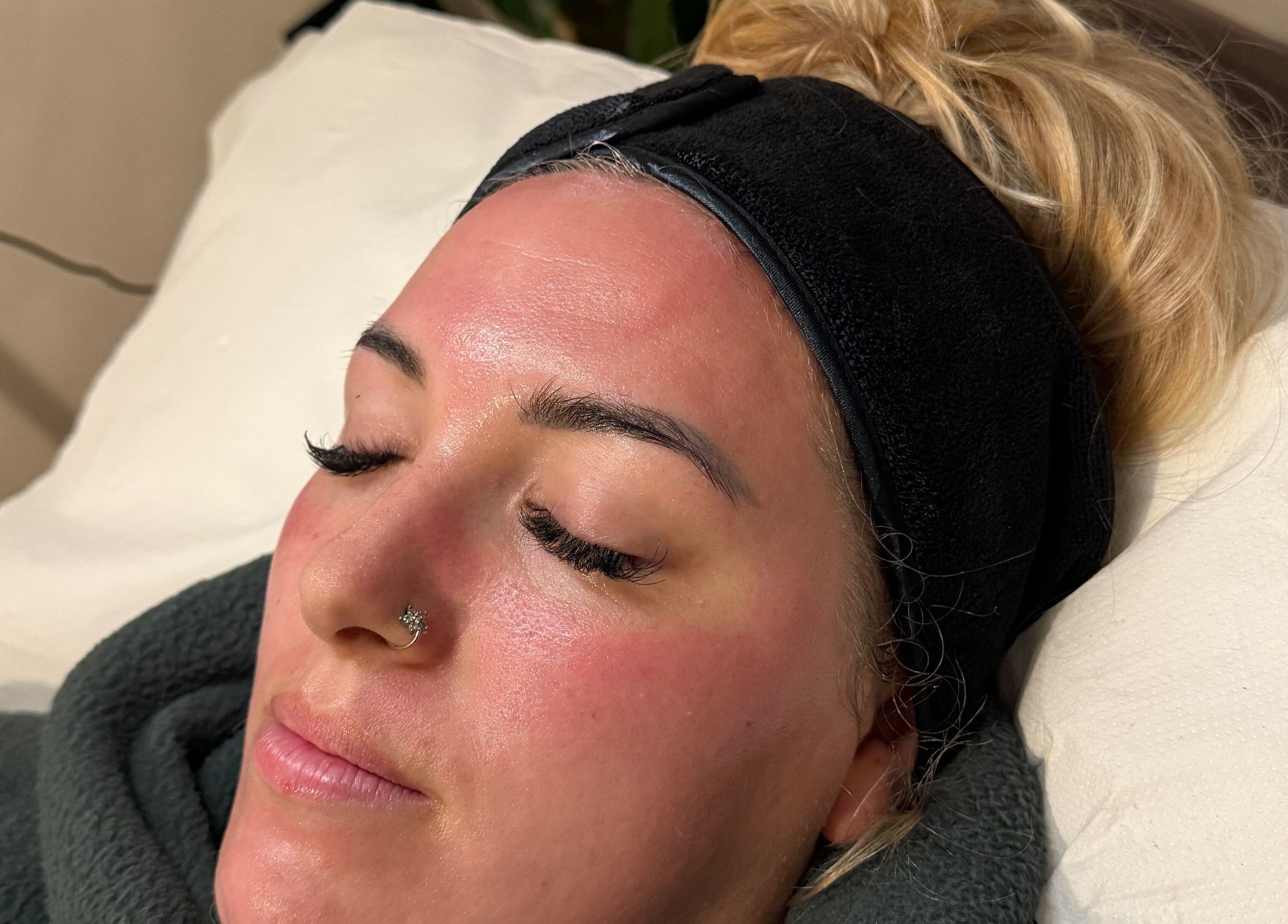 Client enjoying facial treatment at Bare and Glow Skin, Ripon, England, GB. Relaxing and rejuvenating experience.