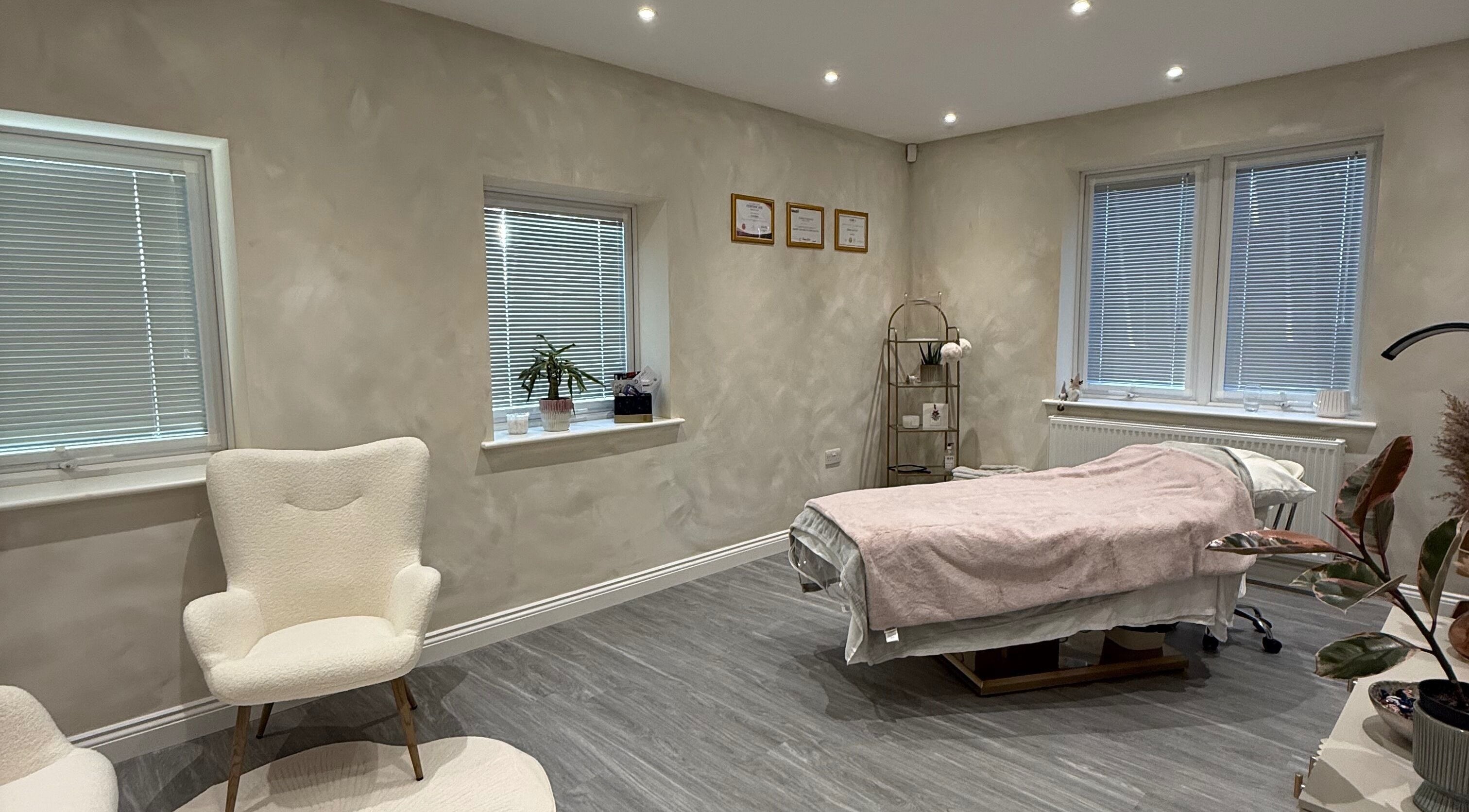 Relaxing treatment room at Bare and Glow Skin, Ripon, England, GB. Featuring a plush bed and calming decor.