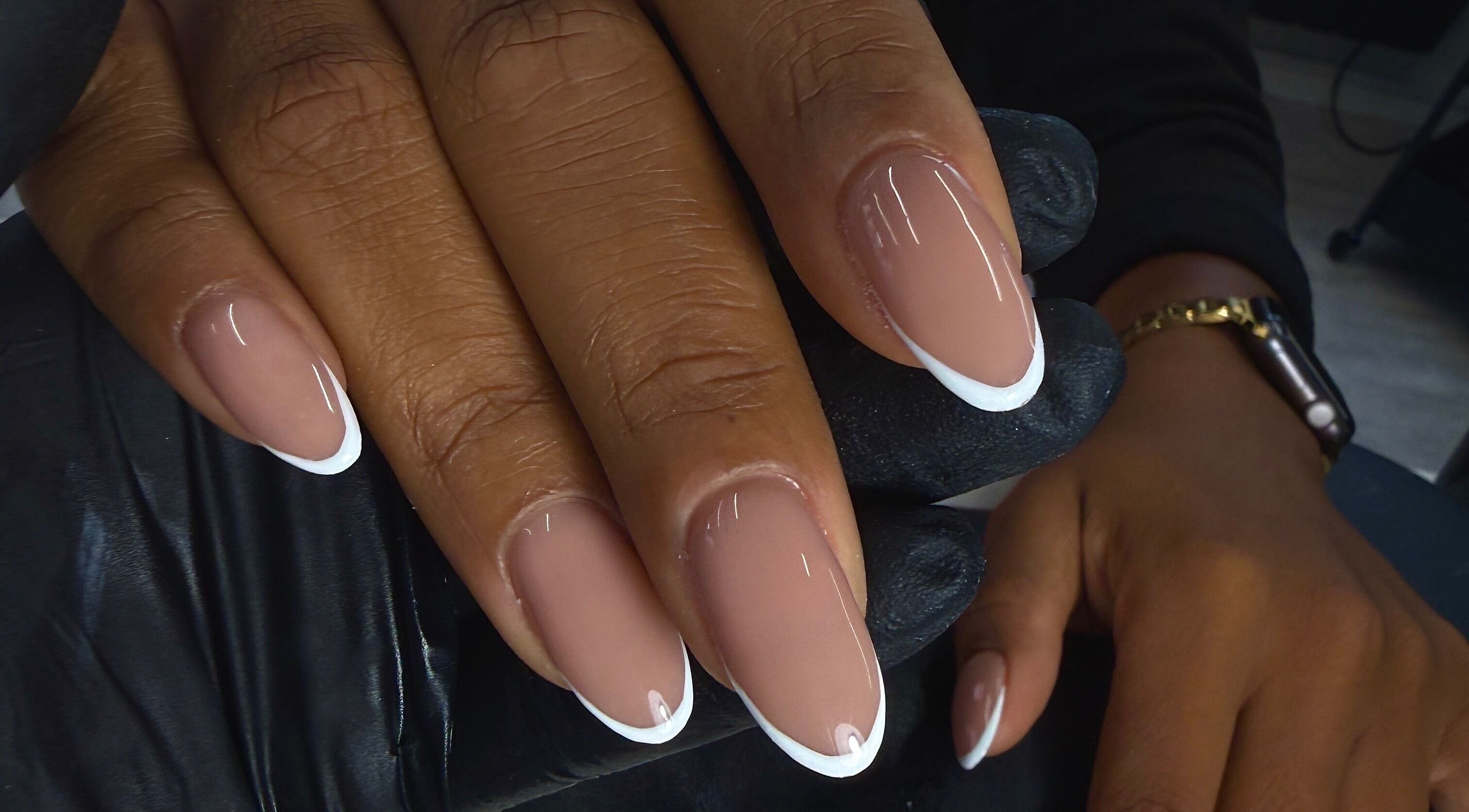 Elegant French manicure at LoveNails in Dartford, Англия, GB, showcasing neat nude and white tips.