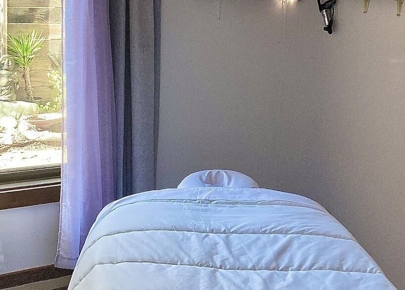 Calming massage room at Therapeutic Touch, Sonoma, California, US. Soft lighting and serene vibes.