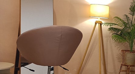 Radiance Beauty By Jenny salon corner with stylish chair and lamp in Jensen Beach, Florida, US.