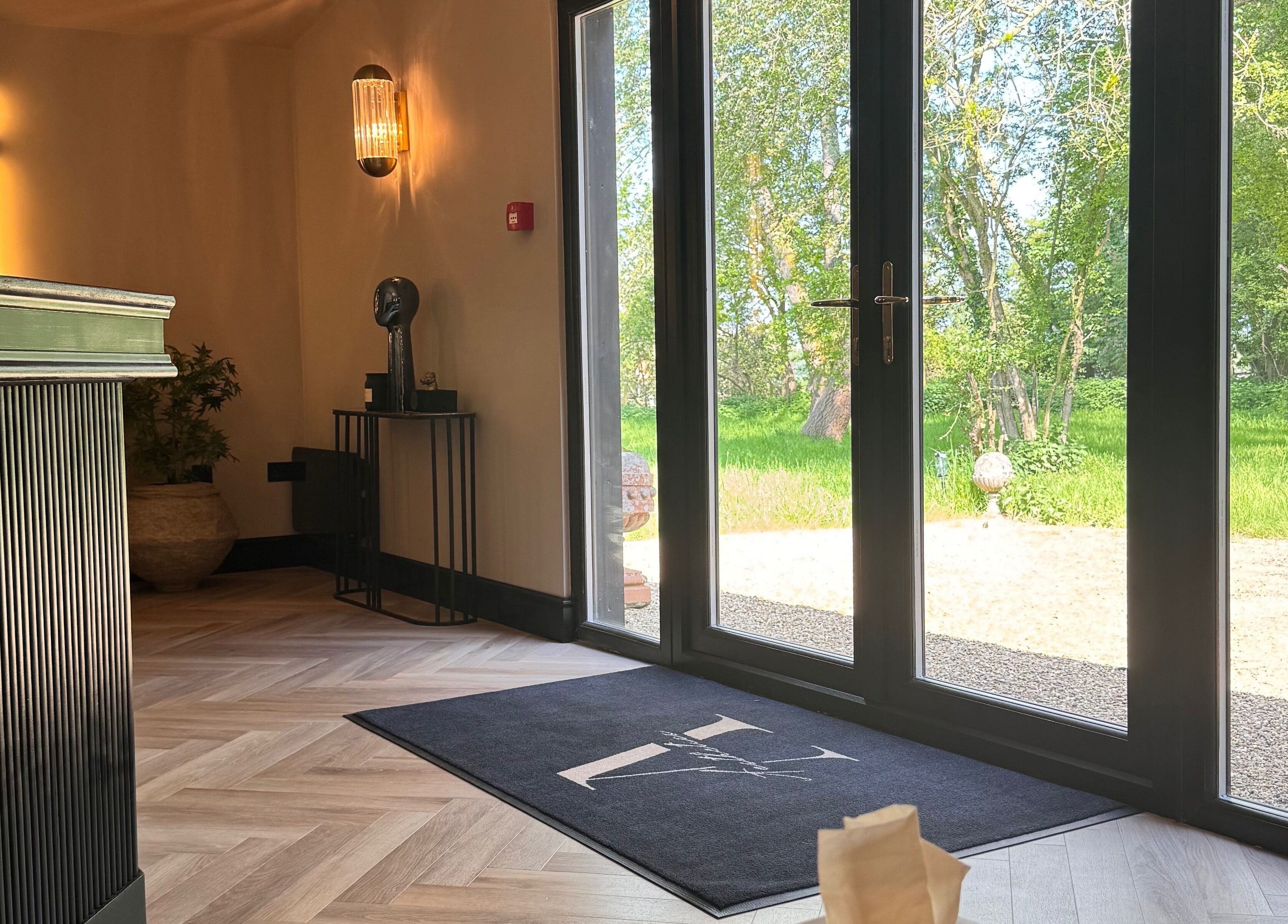 Inviting interior of Beauty by Elle, East Harling, England, with elegant decor and nature views.