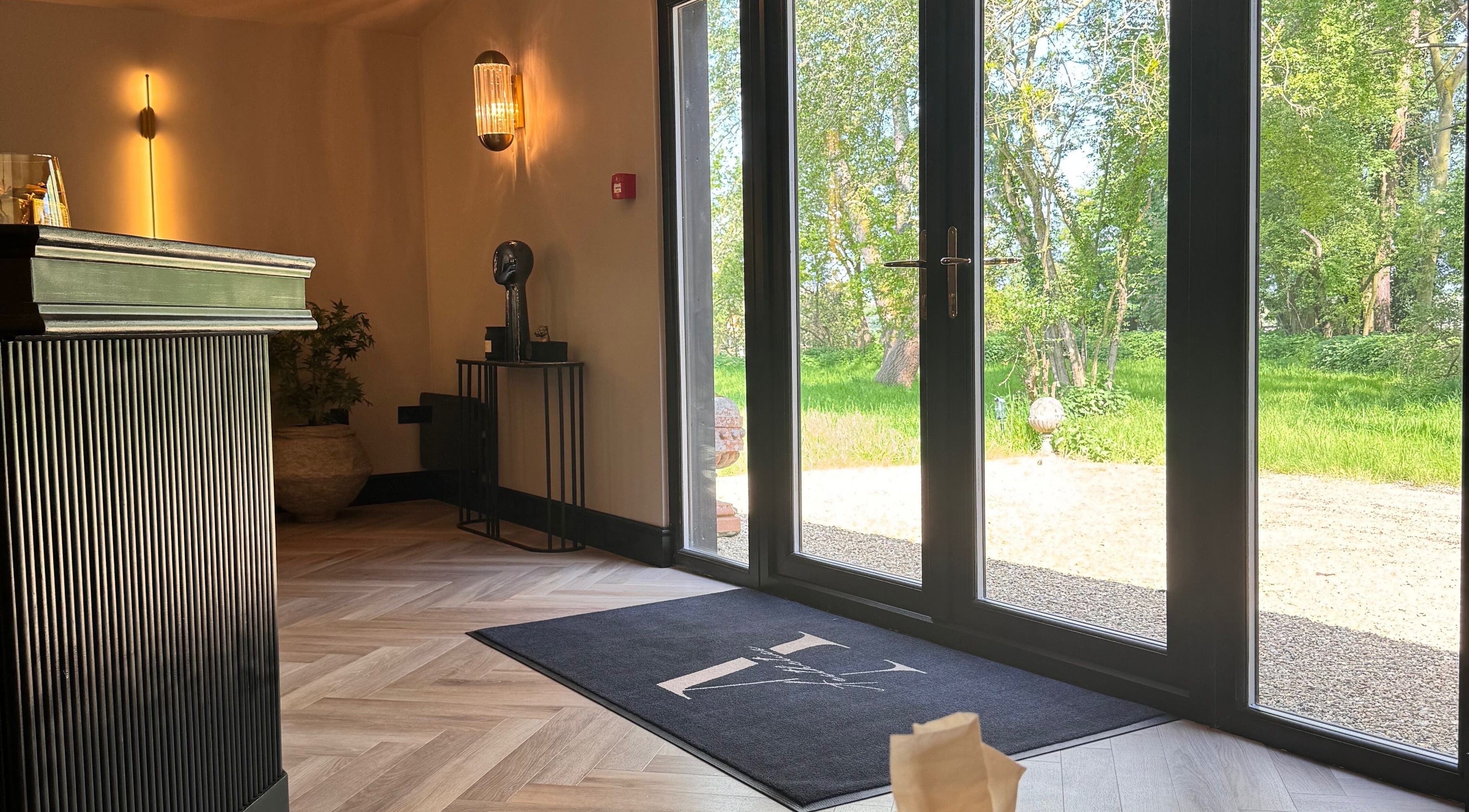 Inviting interior of Beauty by Elle, East Harling, England, with elegant decor and nature views.