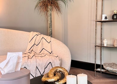 Cozy corner at Beauty by Elle in East Harling, England featuring chic decor and soft lighting.