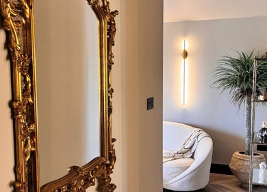 Elegant interior of Beauty by Elle in East Harling, England, GB with ornate golden mirror and modern lounge area.