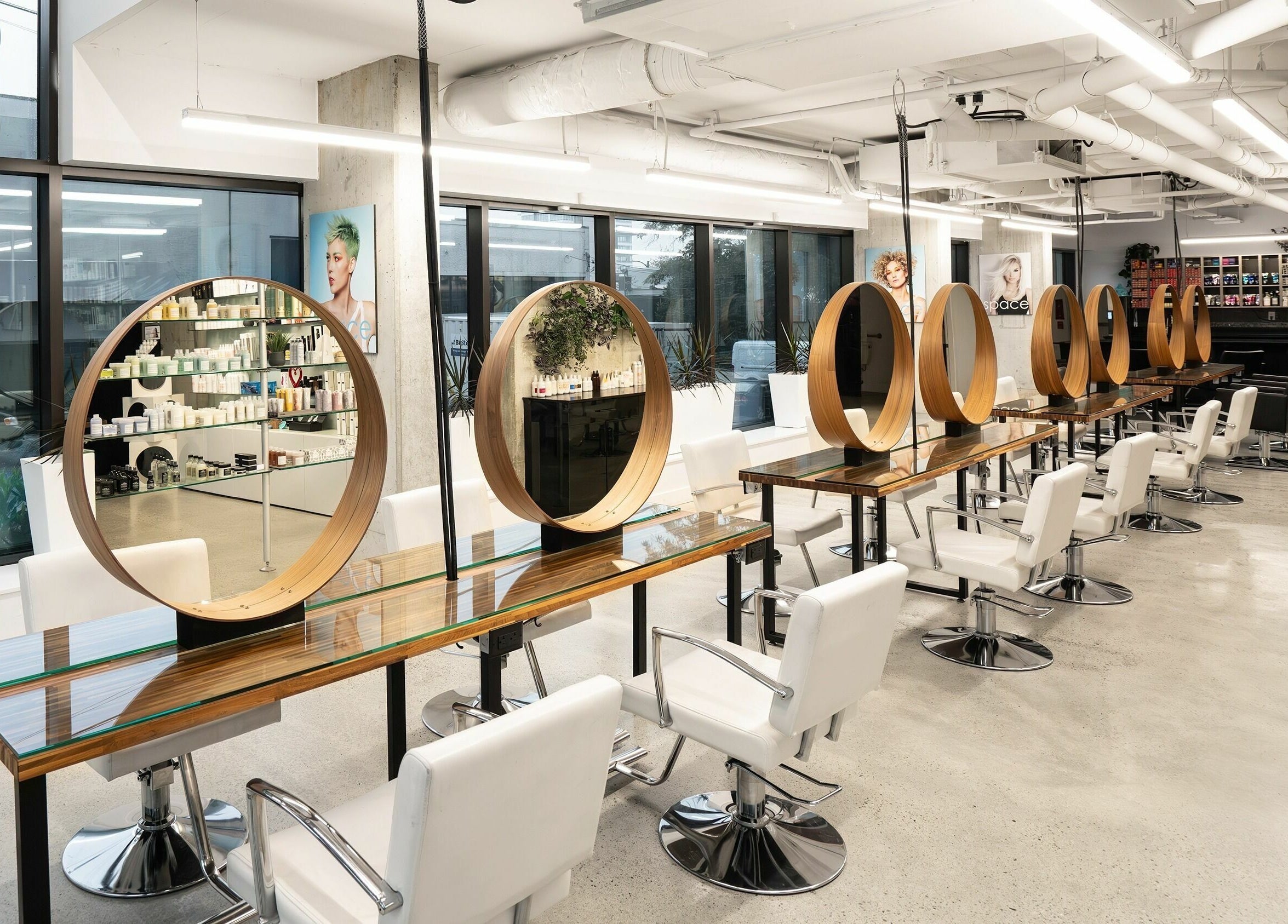 Modern interior of Space Salon - Vancouver showcasing stylish chairs, mirrors at Vancouver, British Columbia, CA.