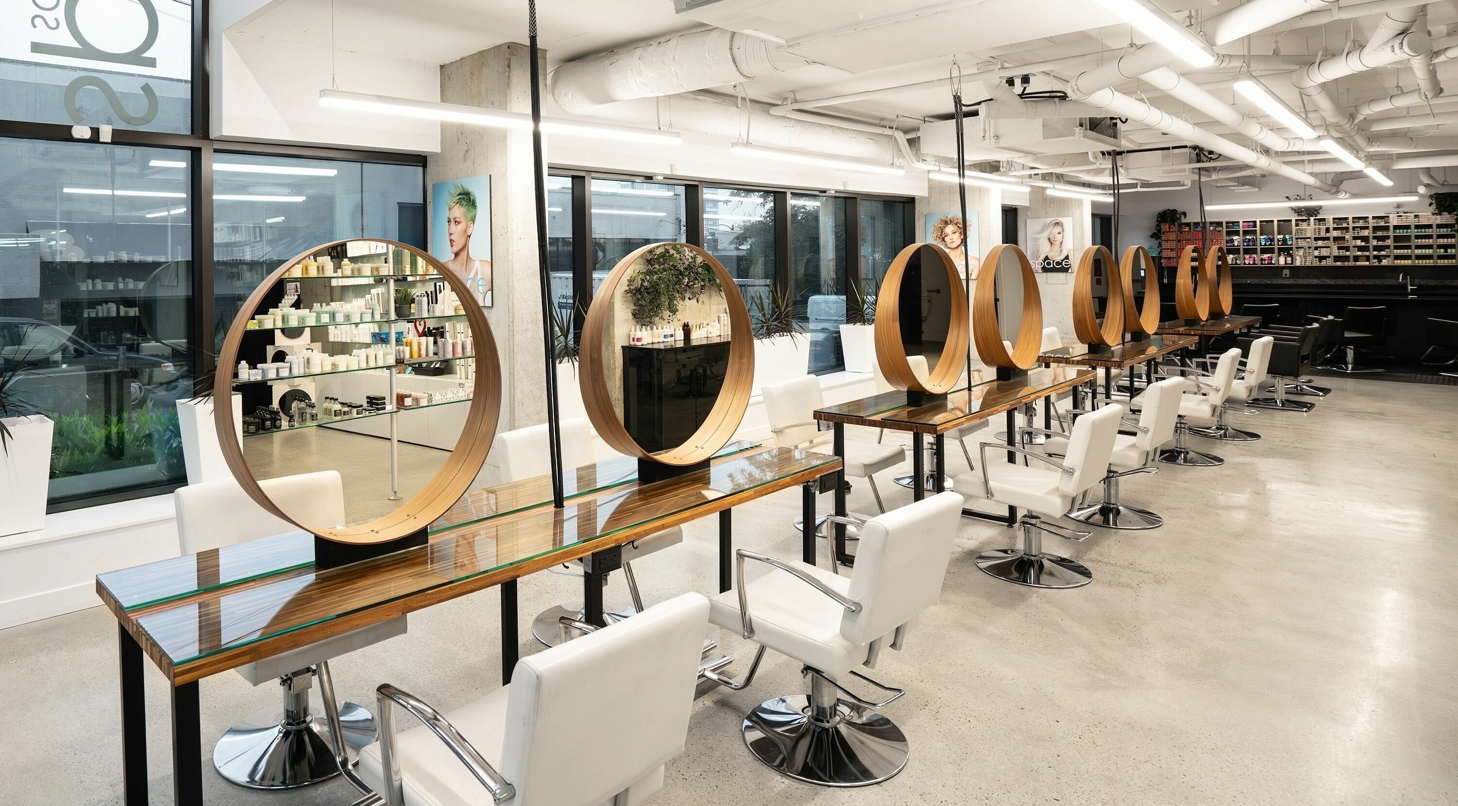 Modern interior of Space Salon - Vancouver showcasing stylish chairs, mirrors at Vancouver, British Columbia, CA.