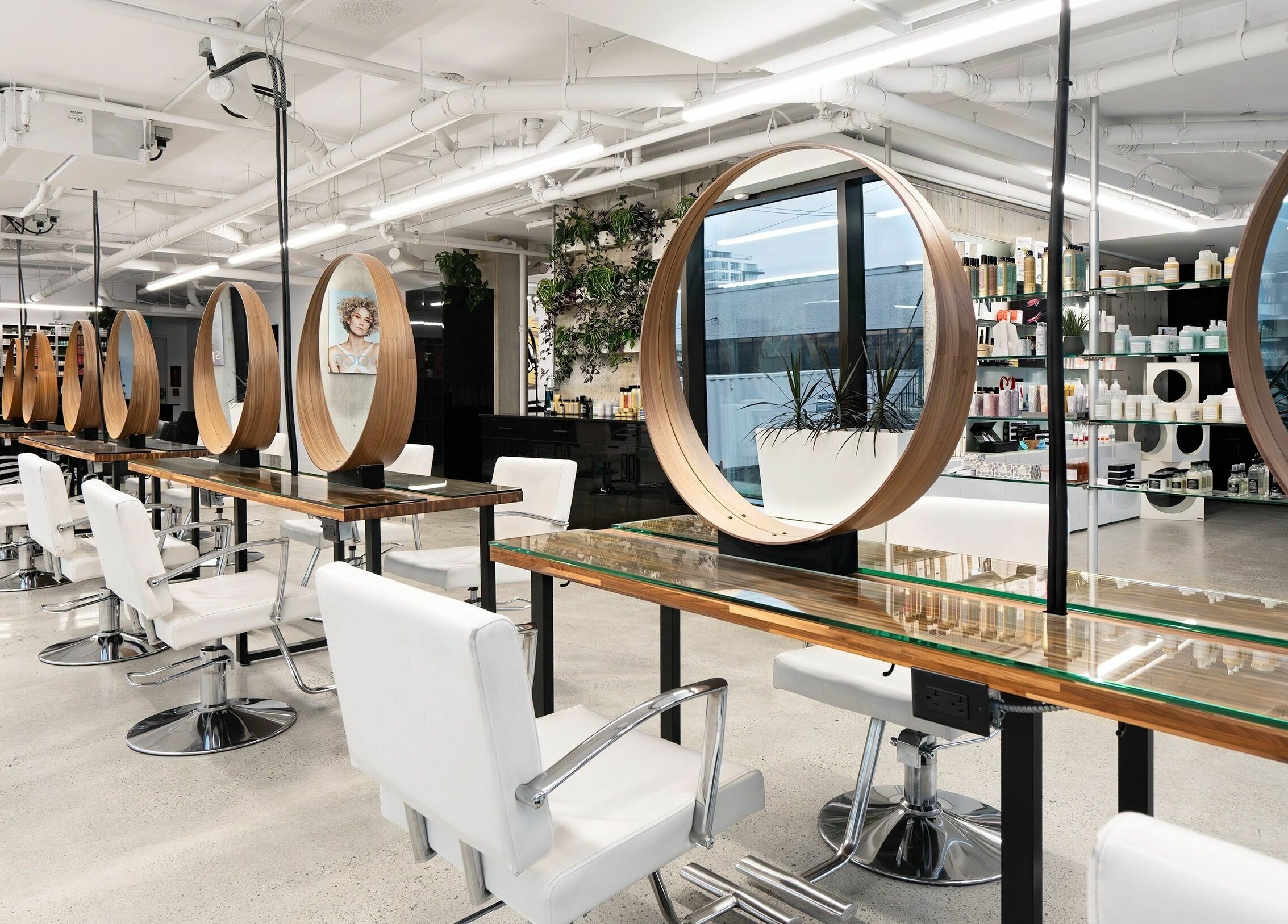Modern interior of Space Salon - Vancouver with stylish mirrors and chairs in Vancouver, British Columbia, CA.