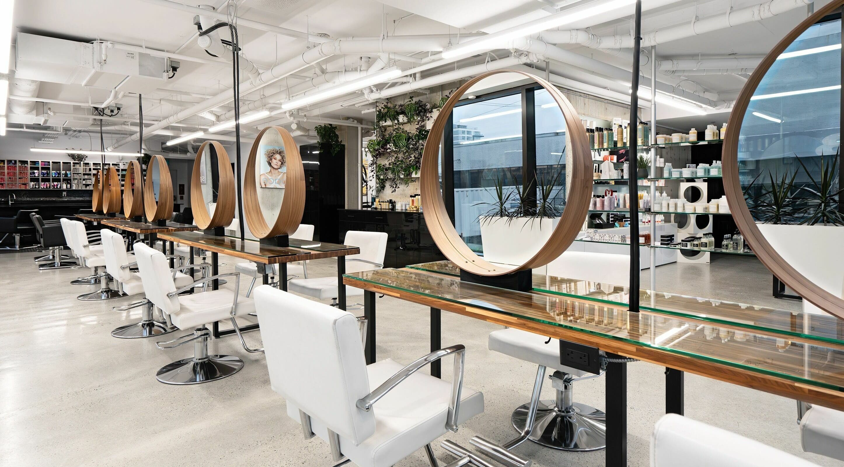 Modern interior of Space Salon - Vancouver with stylish mirrors and chairs in Vancouver, British Columbia, CA.