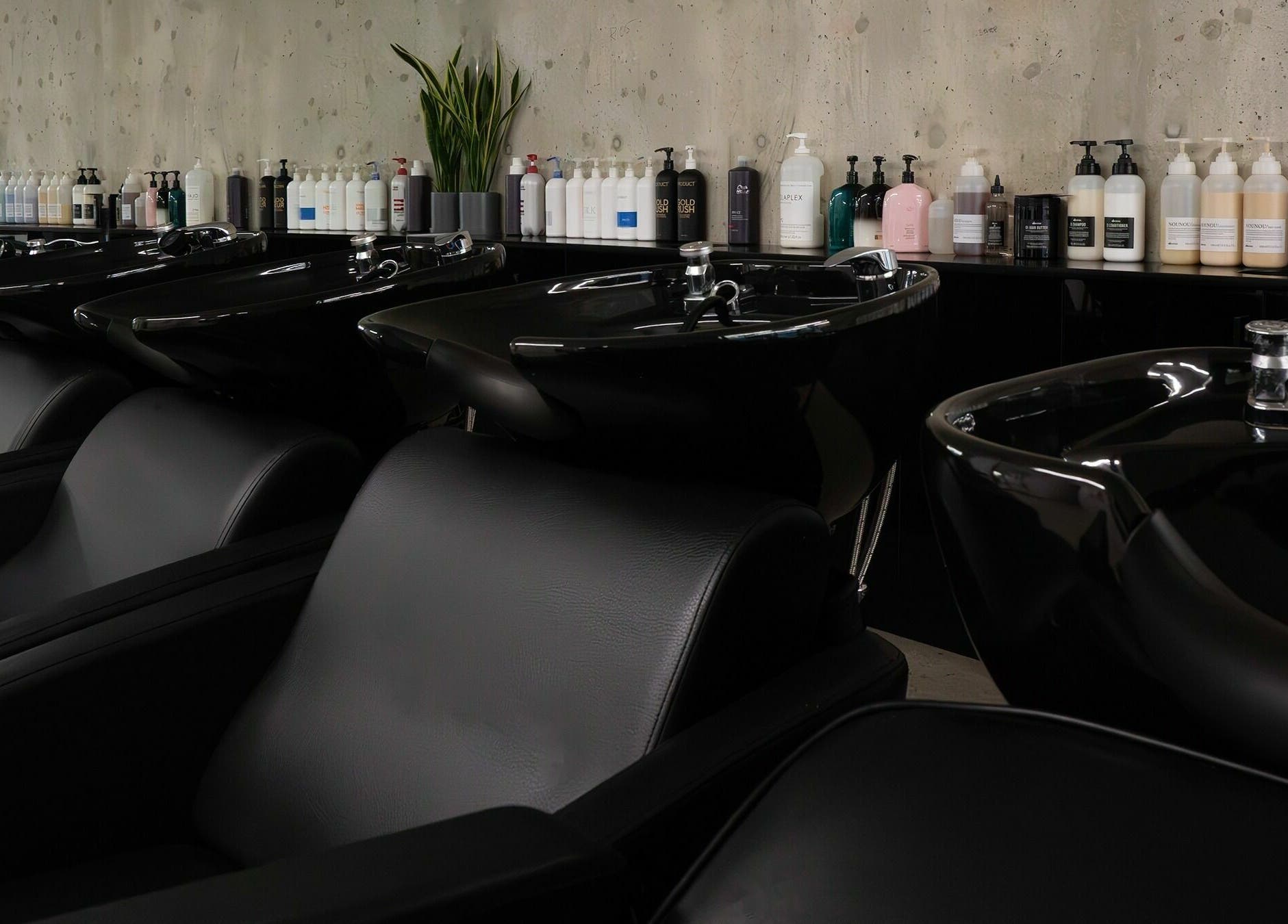 Modern wash stations at Space Salon - Vancouver, Vancouver, British Columbia, CA offering premium hair care.