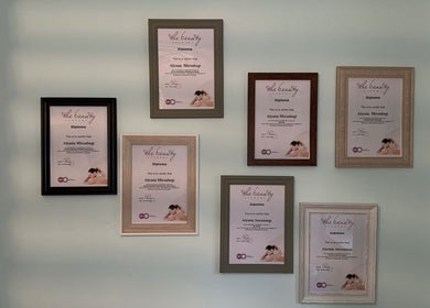Framed diplomas displayed on a wall at TAKE TIME FOR YOU, -, England, GB, showcasing expertise in beauty treatments.