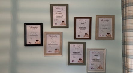 Framed diplomas displayed on a wall at TAKE TIME FOR YOU, -, England, GB, showcasing expertise in beauty treatments.