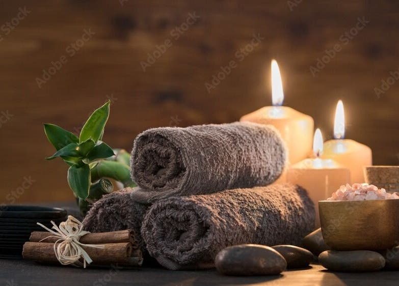Serene spa setup with candles, towels, and salts at Apex Retreat, Algiers, Algiers Province, DZ.