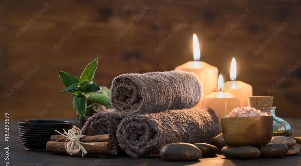 Serene spa setup with candles, towels, and salts at Apex Retreat, Algiers, Algiers Province, DZ.
