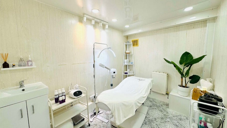 Calm treatment room at Lalice Spa & Beauty, London, England, GB. Featuring a modern spa bed and soothing decor.