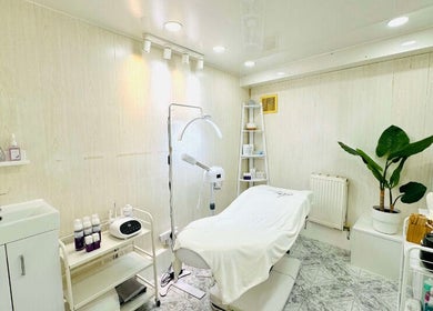 Calm treatment room at Lalice Spa & Beauty, London, England, GB. Featuring a modern spa bed and soothing decor.