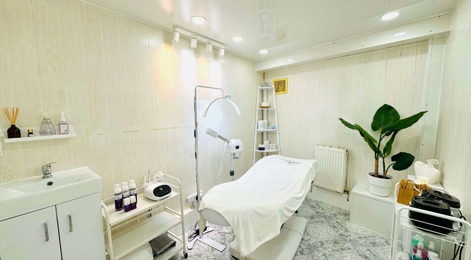 Calm treatment room at Lalice Spa & Beauty, London, England, GB. Featuring a modern spa bed and soothing decor.