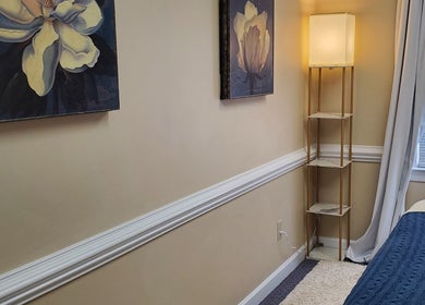 Serene massage room at Magnolia Massage Arts, Cary, North Carolina, US, featuring elegant magnolia wall art.
