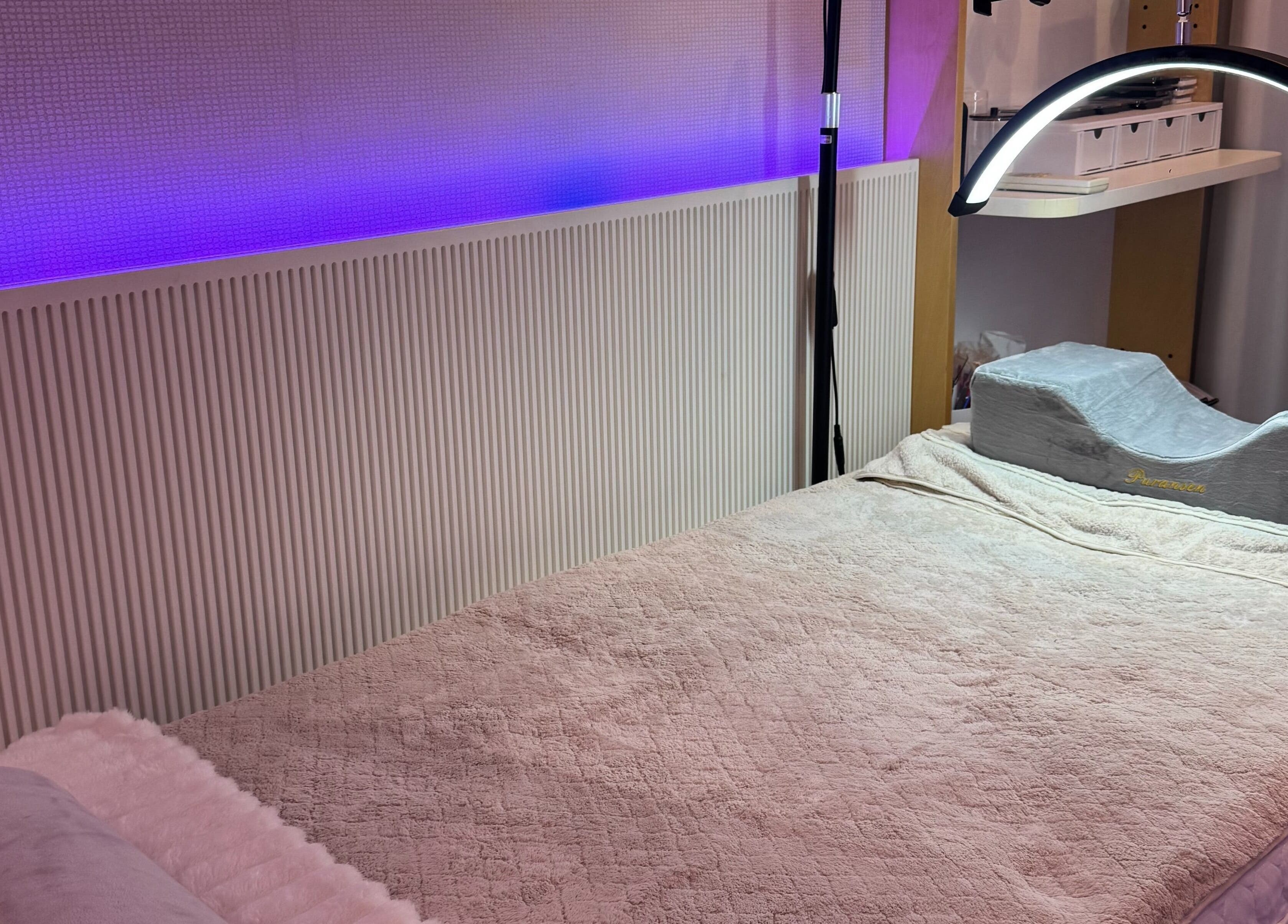 Relaxing treatment room at Bondi Beauty Studio, Bondi Junction, New South Wales, AU with soft lighting.