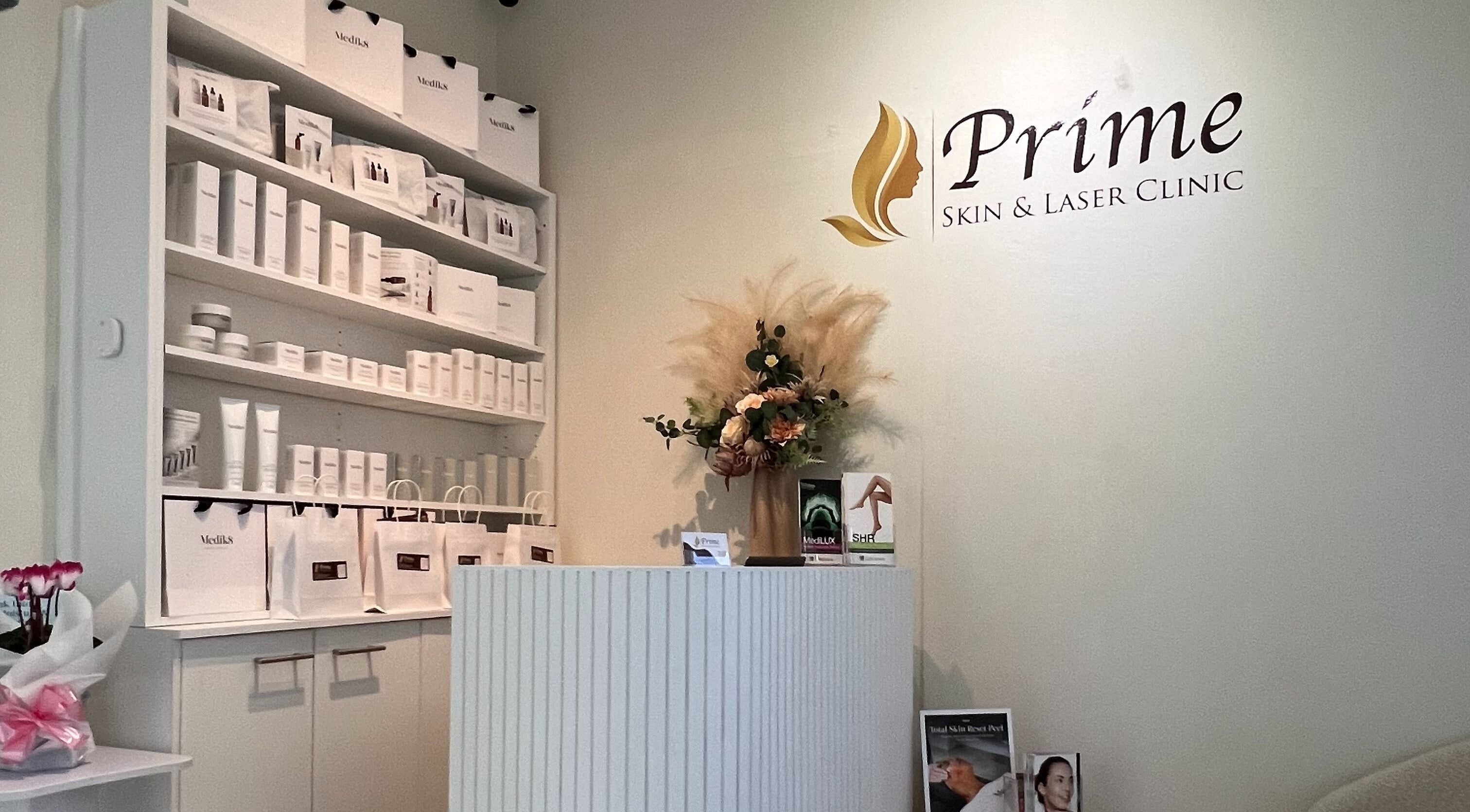 Reception area at Prime Skin and Laser Clinic in Strathfield, showcasing skincare products and elegant decor.