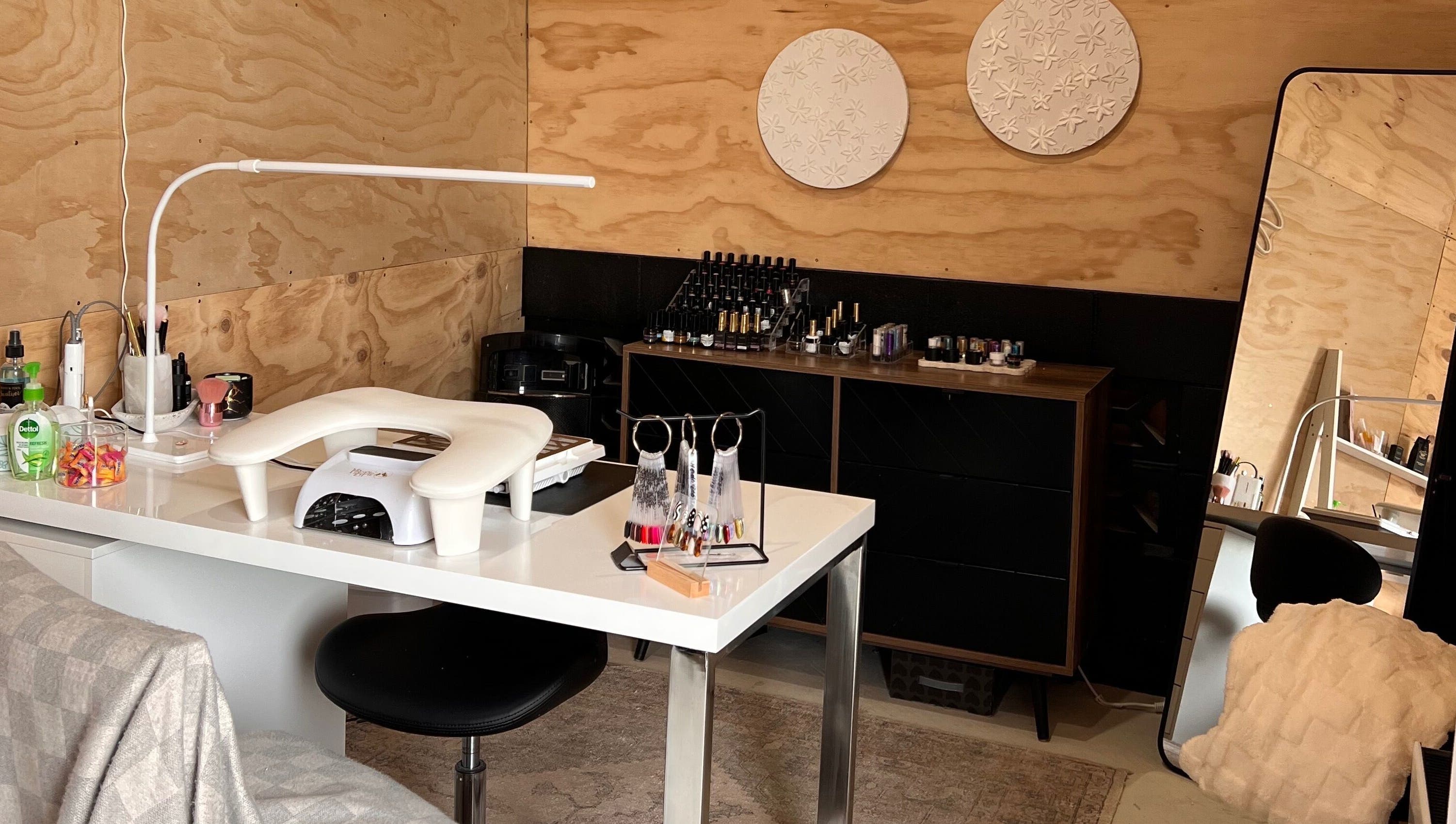 Nail workstation at Studio L Nails, New Plymouth, Taranaki Region, NZ with polish and decor.