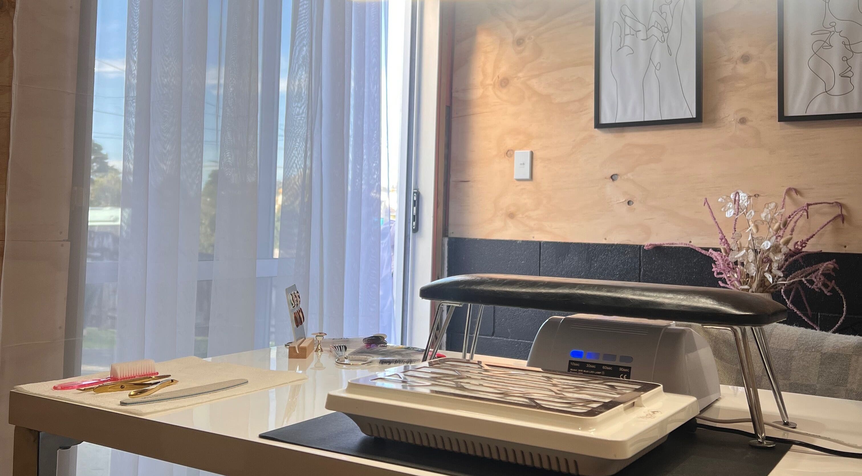 Cozy nail station at Studio L Nails in New Plymouth, Taranaki Region, NZ with tools and decor.