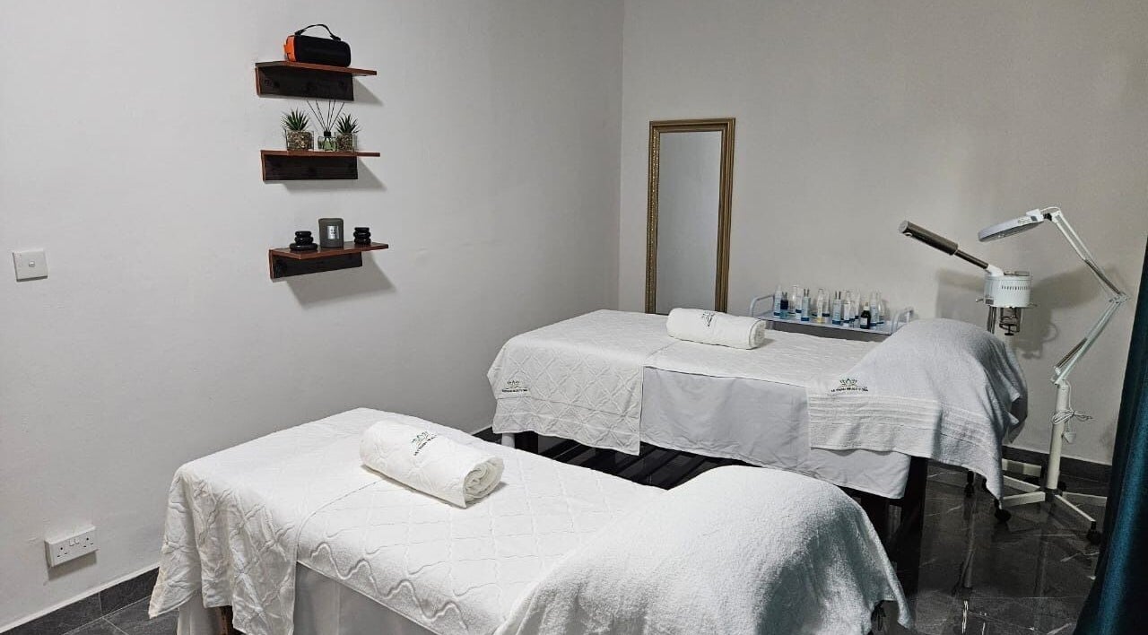 Serene spa room at Mutnan Beauty Spa, Lusaka. Features massage beds and calming decor for a relaxing experience.
