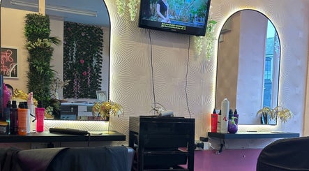 Elegant salon interior at Dream Hair&Beauty by Rachel, Spilsby, England, GB, featuring stylish mirrors and greenery.