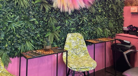 Vibrant foliage wall and leopard chair at Dream Hair&Beauty by Rachel, Spilsby, England, GB.