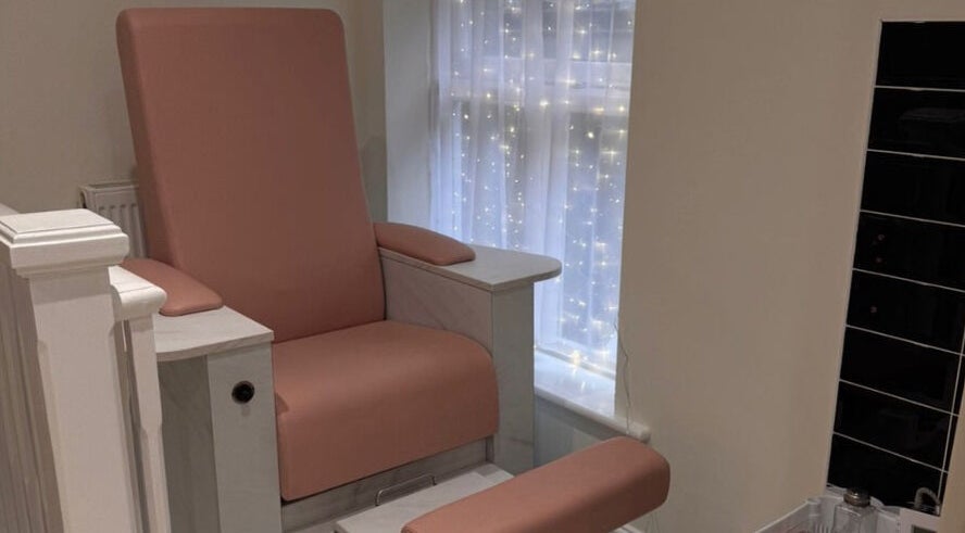 Comfortable pink spa chair at Simply Beauty in Ramsey, Ramsey, IM, perfect for pedicures and relaxation.