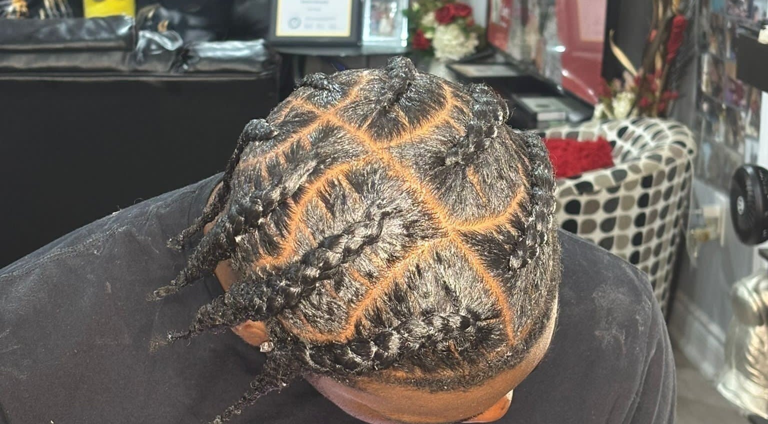 Intricately braided hairstyle at Hair By Nhia, Brampton, Ontario, CA, showcasing expert styling.