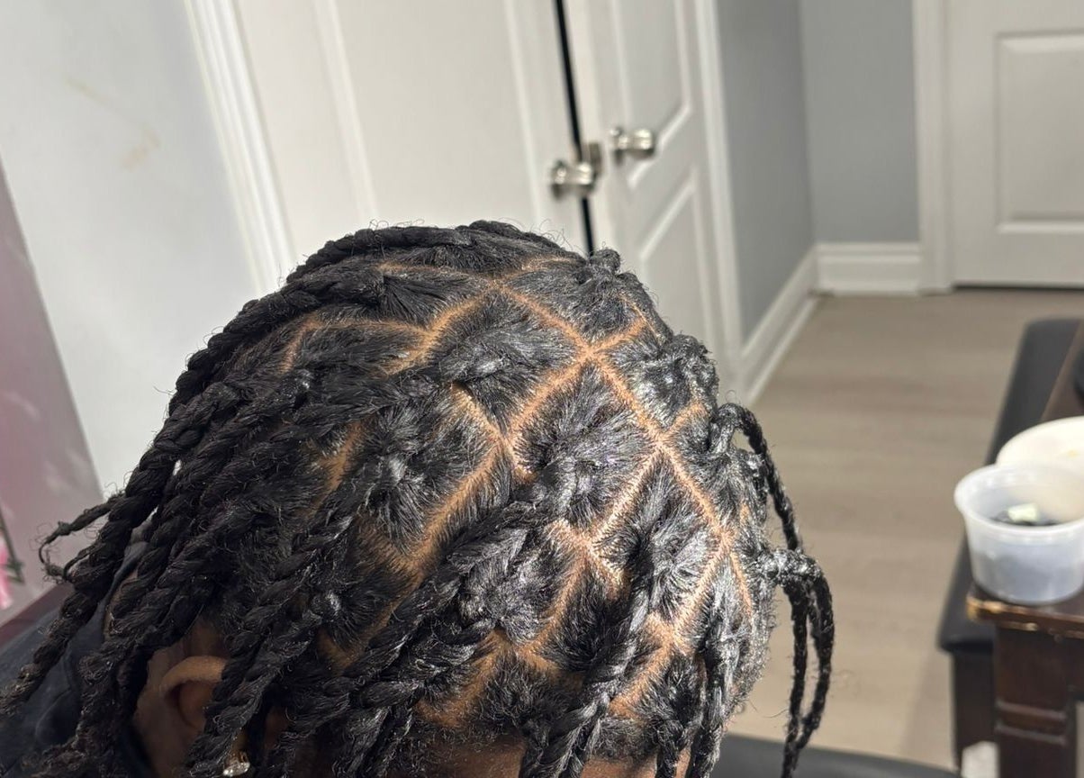 Intricate braided hairstyle at Hair By Nhia, Brampton, Ontario, CA showcasing professional styling techniques.