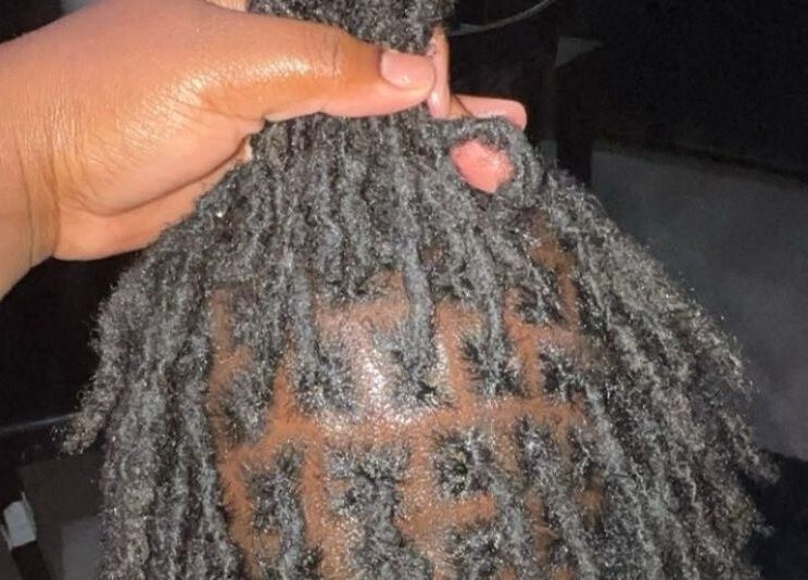 Close-up of intricate braid patterns at Hair By Nhia, Brampton, Ontario, CA, showcasing expert styling.