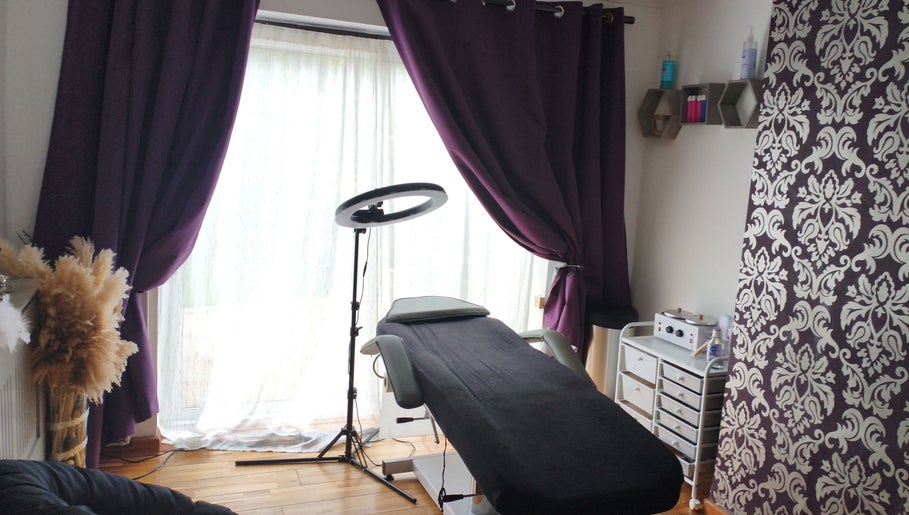 Cozy treatment room at LM Touch in Horley, England, GB with therapeutic setup and elegant decor.