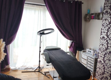 Cozy treatment room at LM Touch in Horley, England, GB with therapeutic setup and elegant decor.
