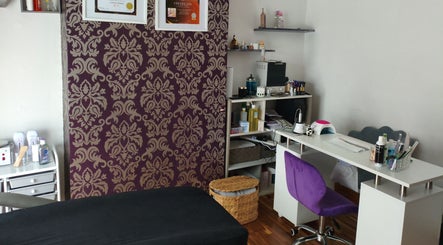 Chic beauty setup at LM Touch, Horley, England, GB featuring a purple chair and elegant decor.