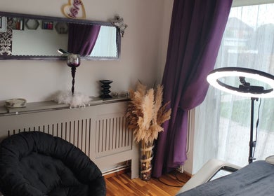 Cozy therapy room at LM Touch in Horley, England, GB with elegant decor and ambient lighting.