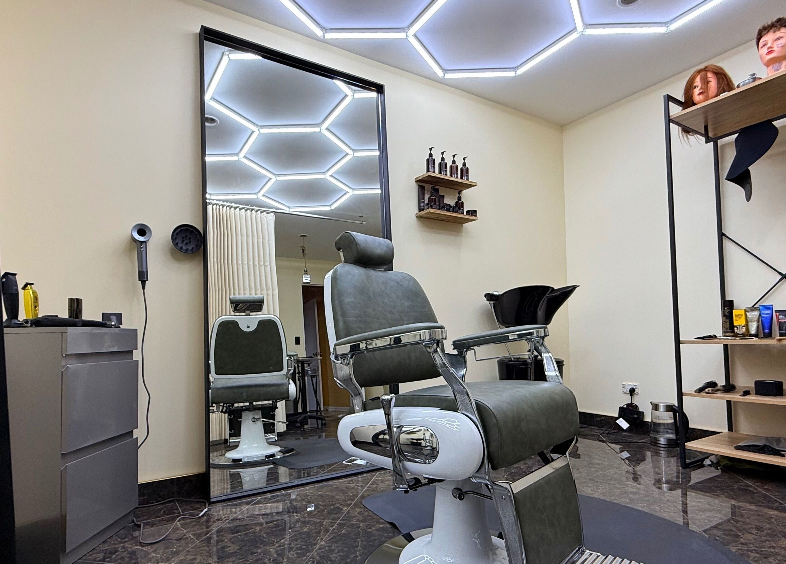 Modern salon chair and station at Park And Cut, Auckland, Auckland, NZ, showcasing stylish interior design.