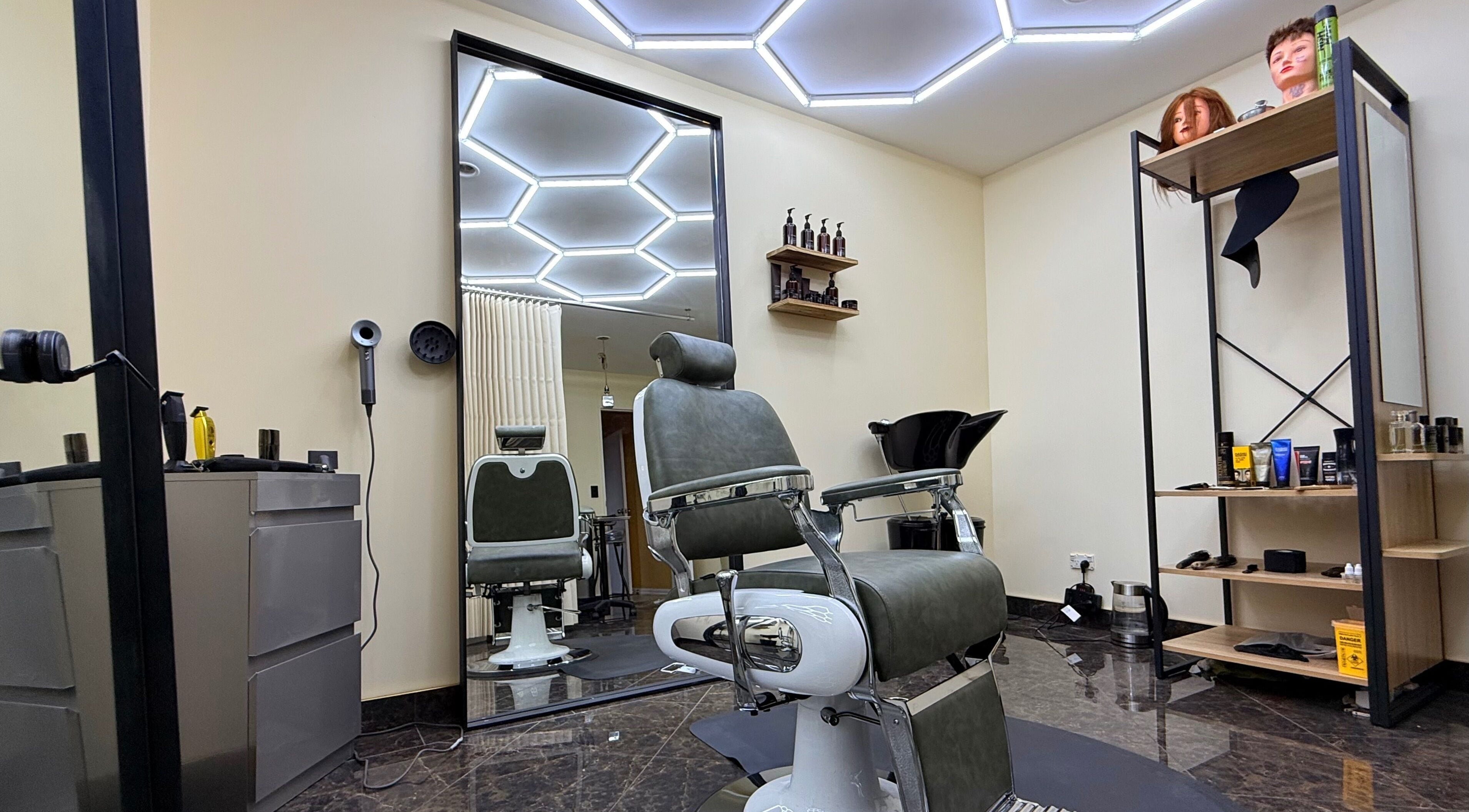 Modern salon chair and station at Park And Cut, Auckland, Auckland, NZ, showcasing stylish interior design.