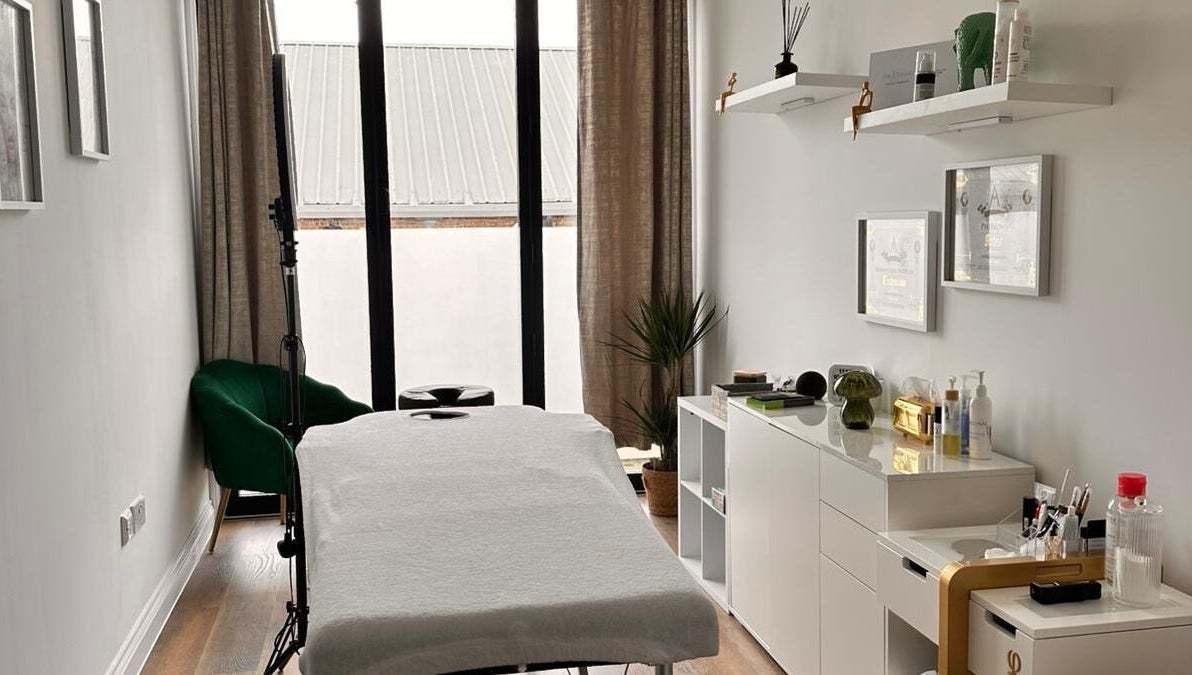 Serenity Massage Therapy room featuring a massage table and modern decor in London, England, GB.