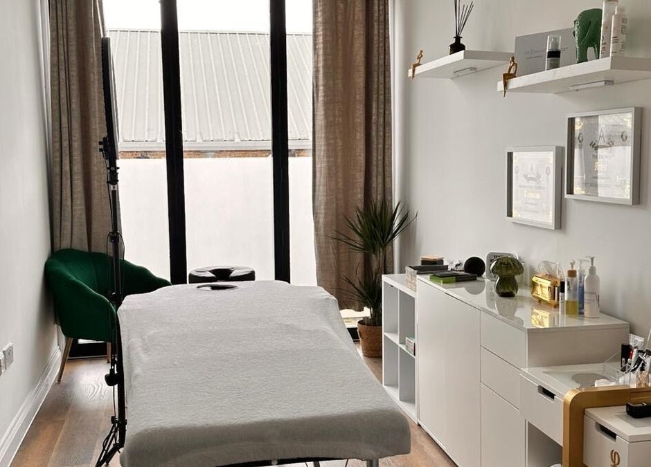 Serenity Massage Therapy room featuring a massage table and modern decor in London, England, GB.