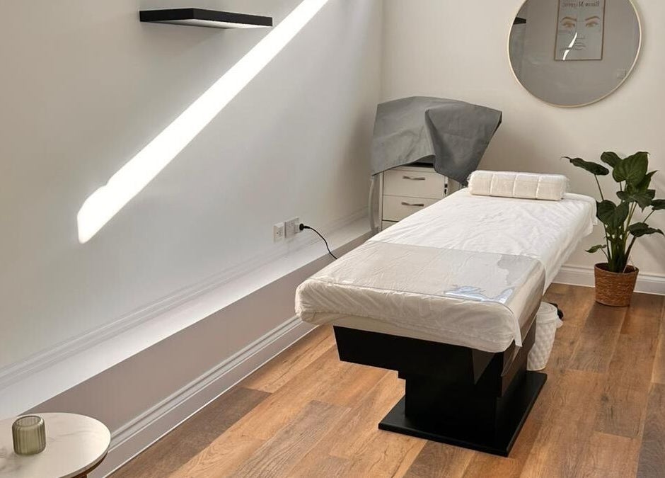 Bright massage room at Serenity Massage Therapy, London, England, GB with modern décor and natural light.