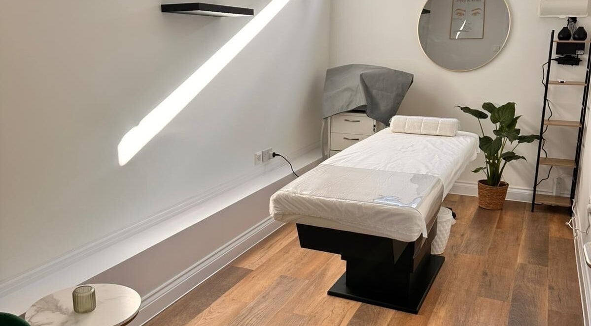 Bright massage room at Serenity Massage Therapy, London, England, GB with modern décor and natural light.