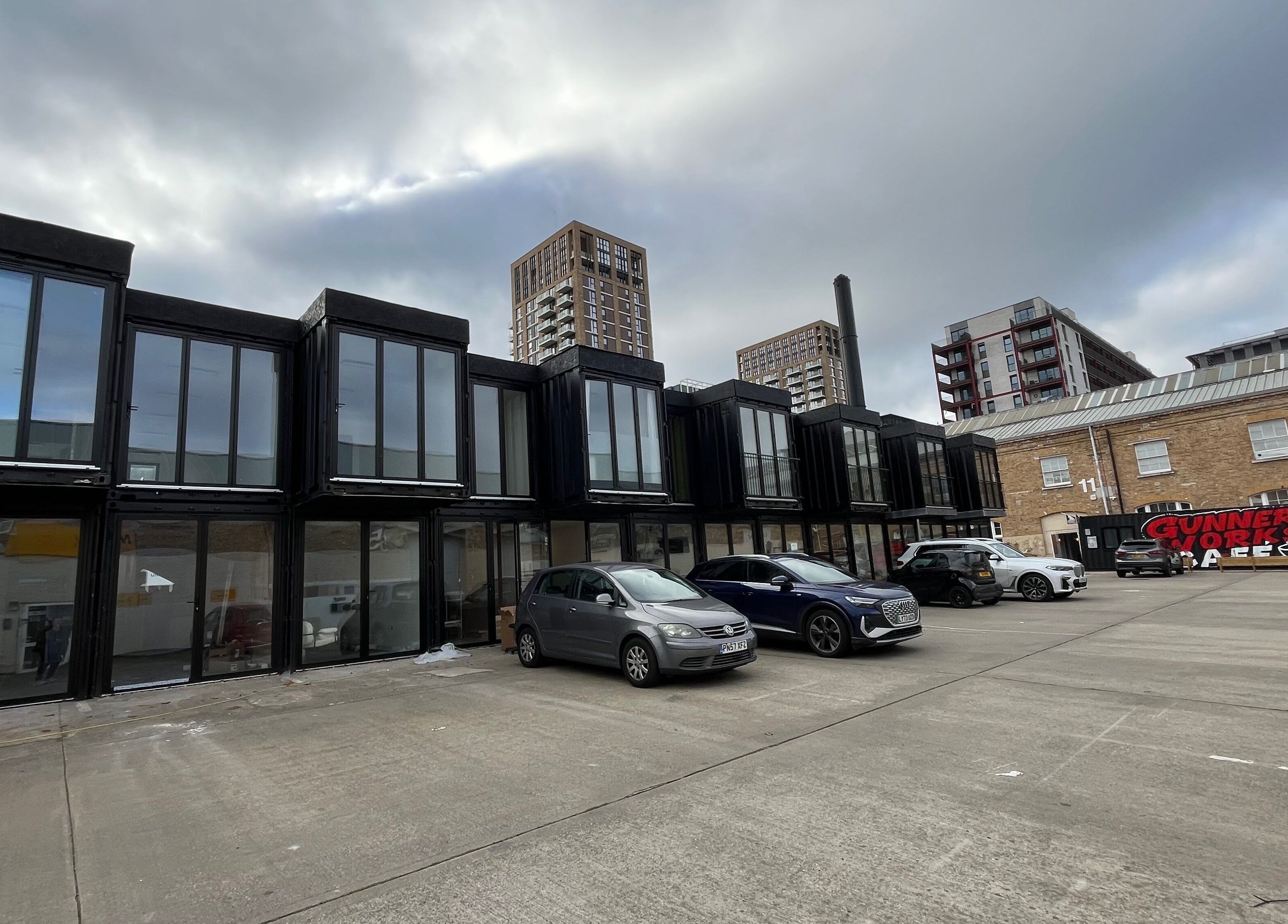 Modern venue exterior of Serenity Massage Therapy in London, England, GB. Contemporary architecture and cars visible.