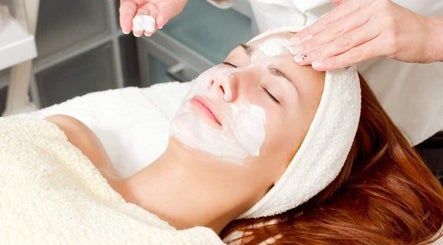 Facial treatment at Royal Beauty Parlour in Berserker, Queensland, AU with cream applied on woman's face.